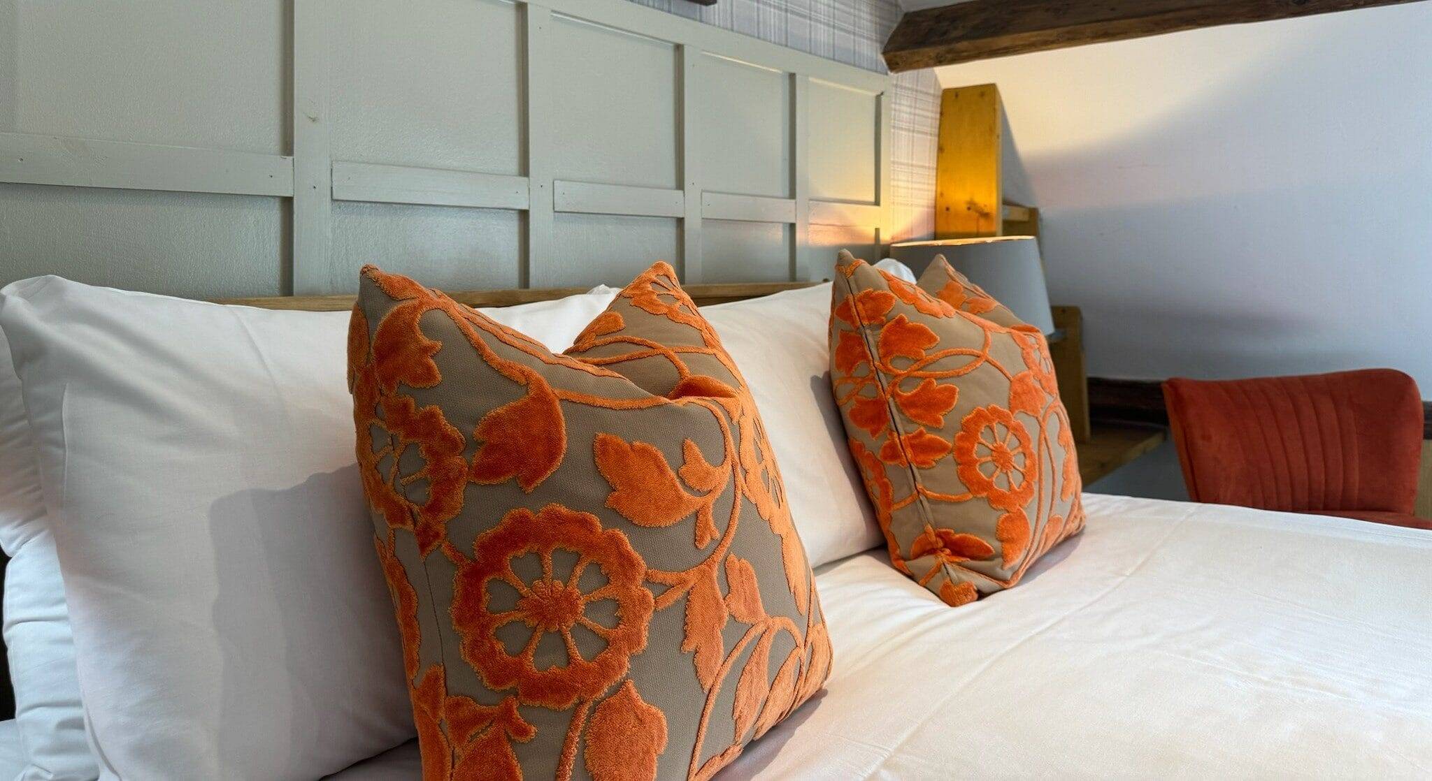 pillows on a bed in a rental property